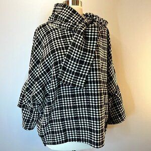 Women's Black and White Poncho with ruffle sleeves and attached scarf